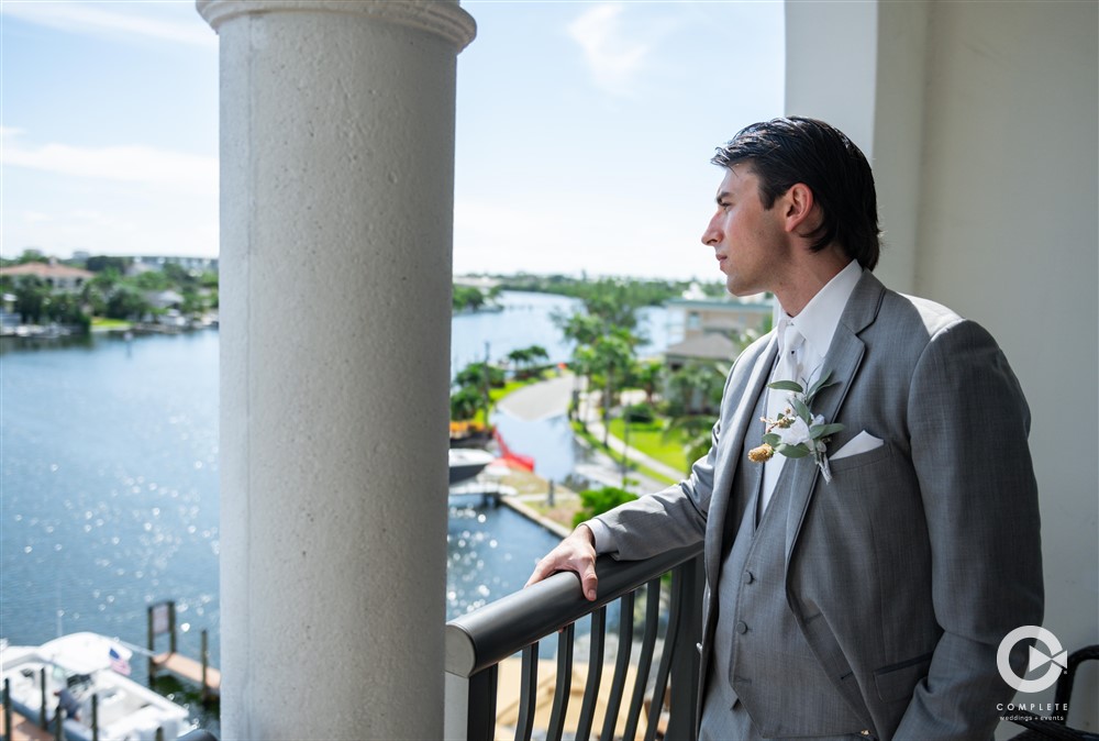 Groom on the balcony of The Hotel Zamora.